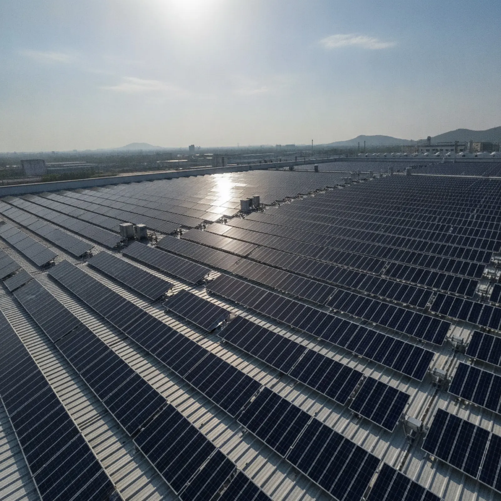 Rows of solar panels on a commercial roof